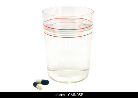 Pills Capsules and glass medical Stock Photo