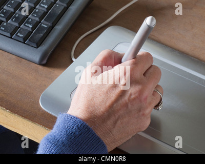Designer using graphics tablet in the office Stock Photo - Alamy