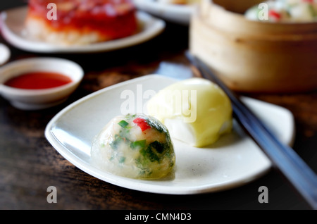 crystal chives dumpling and mini buns on dish Stock Photo