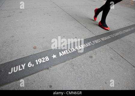 A plaque commemorating Aviatrix Amelia Earhart's tickertape parade after her first trans-atlantic flight in 1928 in New York Stock Photo