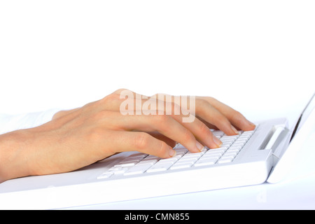 Hands typing on a white laptop - top half of image isolated on white Stock Photo