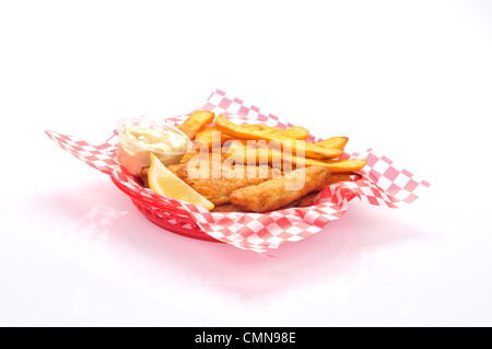 Basket of fish and chips with tartar sauce and lemon wedge Stock Photo