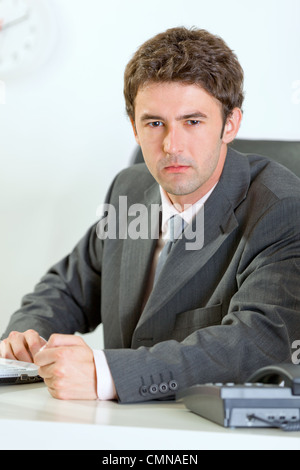 Angry modern business man banging fist on table Stock Photo