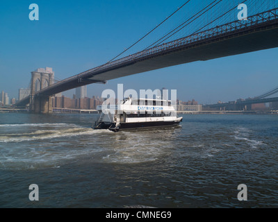 ferry under the Brooklyn Bridge