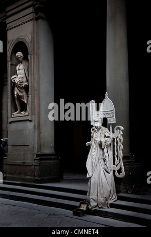 Human statue outside the Uffizi gallery, Florence Stock Photo