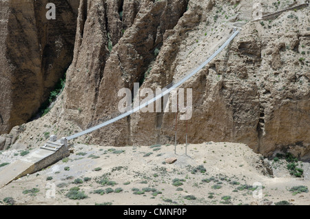 The bridge across the deep canyon near Ghyakar village. Stock Photo