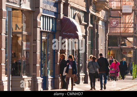 Pedestrians walking along the Promenade in Cheltenham, Gloucestershire, UK Stock Photo