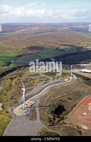 aerial view of two wind turbines under construction on the Pennines Stock Photo