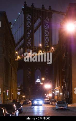 A person walks in front of the Manhattan Bridge in Brooklyn, New York, USA, on February 25, 2012. (Adrien Veczan) Stock Photo