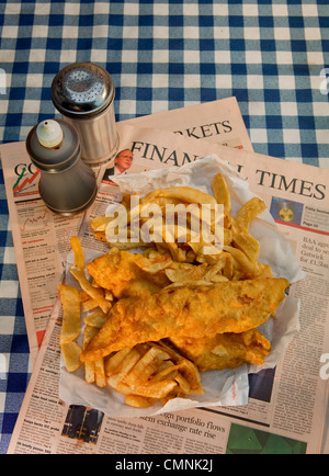 Traditional fish and chips served on the Financial Times Stock Photo