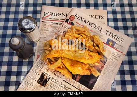 Traditional fish and chips served on the Financial Times Stock Photo