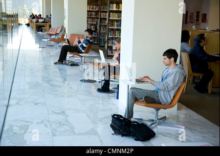 People working and studying in a library Stock Photo