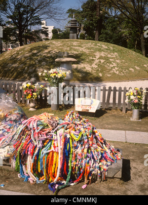 Japan Hiroshima Peace Park Mound of Victims Ashes with strands of 1000 cranes  Stock Photo