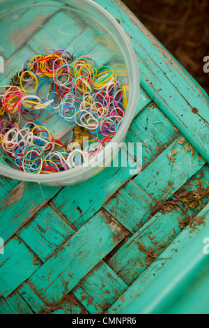 Colorful elastic hair bands with green chair. Stock Photo