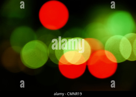 City traffic lights at night. Abstract blurry circles background. Stock Photo