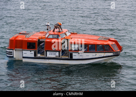 Lifeboat, also known as Tender Ship, lowered from Cruise Ship Maasdam, of Holland America LIne, at Bar Harbor, Maine. Stock Photo