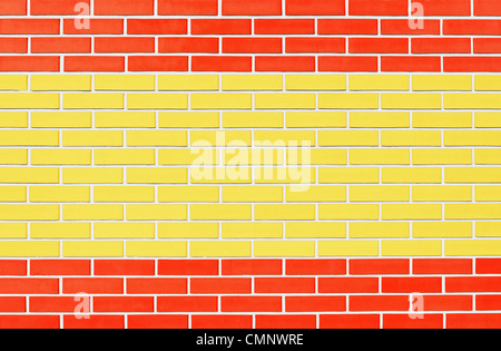Flag of Spain painted onto brick wall. Stock Photo