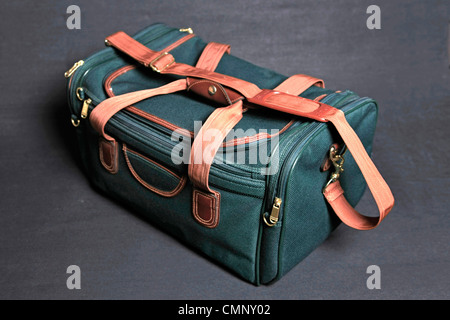 Overnight hold-all luggage bag on a black background Stock Photo