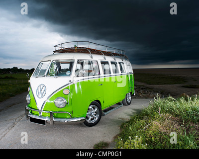 green vw volkswagen split screen camper van bus hippie hippy 1960s 1950s aircooled retro beach british rain cloudy bad weather Stock Photo