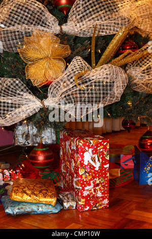 Detail of Christmas tree with decorations and presents Stock Photo