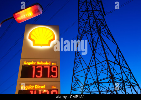 A petrol sation in Billingham on Teeside, UK, with an electricity pylon at dusk. Stock Photo