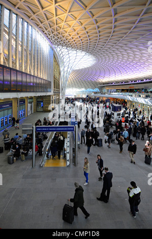 Kings Cross Railway Station departure boards and concourse with exit for underground services Stock Photo