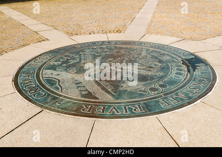 Bronze plaque in Footpath in Belfast Gasworks at the point over where the Blackstaff River meets the Lagan (now underground). Stock Photo