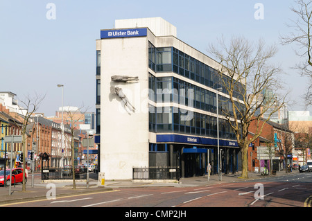The famous Ulster Bank Building at Shaftesbury Square, Belfast with 'Flying Figures' sculptures by Dame Elizabeth Frink,  See C5JD96 for summer shot Stock Photo