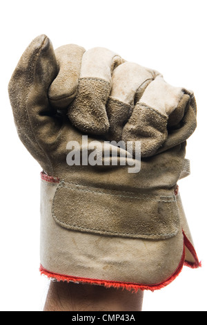 Close-up of worn canvas work glove on raised fist, against white background. Vertical-orientation. Stock Photo