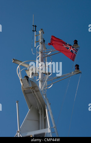 Red Ensign flag flying on the Isle of Wight ferry departing Portsmouth for Fishbourne Stock Photo