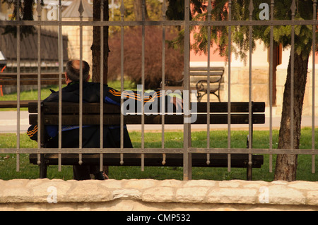 Man sitting on a bench Stock Photo