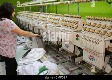 Santiago Chile,Barrio Patronato,Antonia Lopez de Bello,Tajima embroidery machine,garment factory,textile industry,Hispanic woman female women,operator Stock Photo