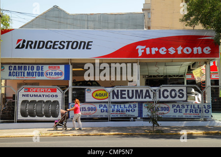 Santiago Chile,Providencia,Avenida Rancagua,Firestone Tire & Rubber Company,Bridgestone,American company,tires,retail sale,car services,sign,Spanish,H Stock Photo
