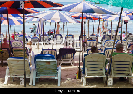 Beach umbrellas and sun loungers on Kamala Beach, Phuket, Thailand Stock Photo