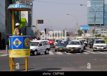 Lima Peru,San Isidro,Avenida Canaval y Moreyra,street scene,Hispanic woman female women,national police,law enforcement,uniform,helmet,traffic cop,yel Stock Photo