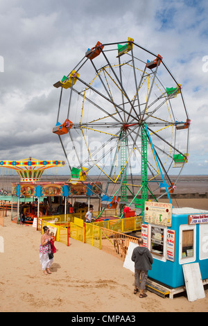 UK, England, Lincolnshire, Cleethorpes, summer funfair on beach in sunshine Stock Photo