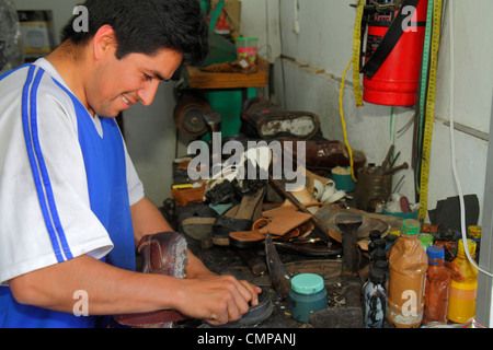 Lima Peru,Barranco,Avenida Pierola,shoe repair,cobbler,shop,Hispanic man men male adult adults,trade,tool,workbench,working,work,Peru120117006