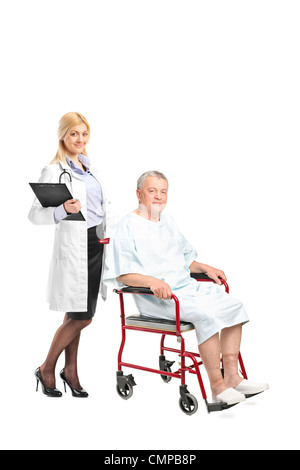 Full length portrait of a nurse or doctor posing next to a patient in a wheelchair isolated on white background Stock Photo