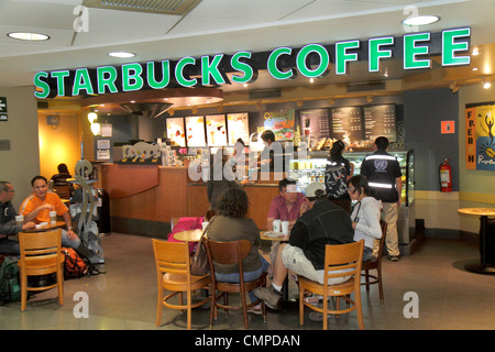 Lima Peru,Jorge Chávez International Airport,LIM,aviation,terminal,cafe,Starbucks Coffee,barista,chain,coffee shop,cafe,Hispanic man men male,woman fe Stock Photo