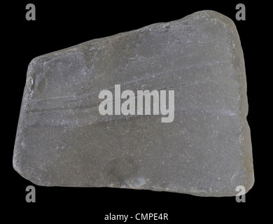 piece of broken white glass polished, smoothed and frosted naturally by a river, isolated on black Stock Photo