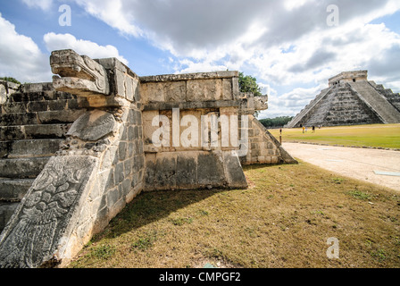 CHICHEN ITZA, Mexico — The Venus Platform, a compact ceremonial structure in the ancient Maya city of Chichen Itza, features distinctive jaguar head sculptures flanking its stairway. The platform, dedicated to the planet Venus, demonstrates the Maya's sophisticated understanding of astronomy and its integration into religious architecture. This structure stands near the central plaza of the archaeological complex, forming part of the city's ceremonial core. Stock Photo