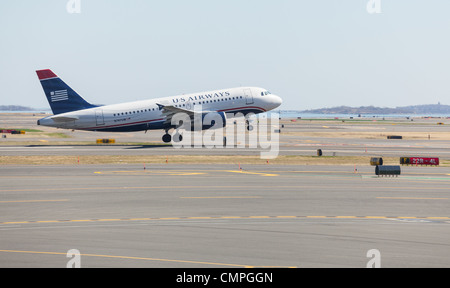 BOSTON, USA - MARCH 22: US Airways Airbus A319 takes off on March 19, 2012. Logan Airport is the largest in New England Stock Photo