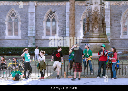 Group of teenagers hanging out after the St Patrick's day parade in downtown Montreal. Stock Photo