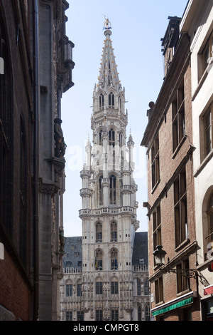 Ornate Brussels Town Hall in Grand Place through narrow alley Stock Photo