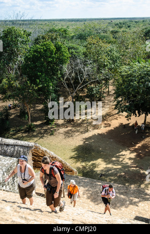 EK BALAM, Mexico - Tourists climb the steps of the Acropolis at Ek'Balam, one of the Mayan civilization ruins on Mexico's Yucatan Peninsula not far from Coban and Chichen Itza. Stock Photo