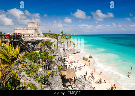 Tulum Ruins El Castillo Pyramid Caribbean Coast Tulum Mexico // TULUM, Mexico — El Castillo pyramid overlooks the Caribbean coastline at the ancient Maya archaeological site of Tulum. The Tulum ruins, perched on 12-meter (39-foot) limestone cliffs, served as a major trading port for the Maya civilization from approximately 1200 to 1450 CE. This walled coastal city was among the last Maya settlements to be inhabited when Spanish conquistadors arrived in the early 16th century. The archaeological site combines ancient limestone temples and structures with white sand beaches along Mexico's Caribb Stock Photo