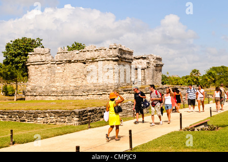 Tulum Maya Ruins Tulum Mexico // TULUM, Mexico — The ruins of the ancient Maya city of Tulum overlook the Caribbean Sea on Mexico's Yucatan Peninsula coast. The archaeological site was once known as Zama, meaning 'dawn,' as it sits on the far eastern edge of Mexico where sunrise first appears over the country. Tulum served as an important commercial port from approximately the 13th to 15th centuries, facilitating extensive trade networks throughout Central America and Central Mexico. The walled city was among the last Maya settlements to be inhabited when Spanish conquistadors arrived in the e Stock Photo