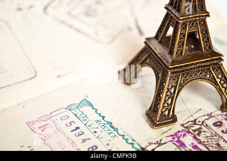 Stamped passport with Eiffel passport - travel to Paris concept Stock Photo