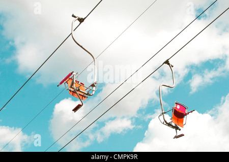 Two empty ski lifts over blue sky Stock Photo