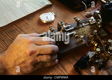 1890s 1900s TELEGRAPH OPERATOR HAND ON KEY Stock Photo